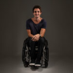 Dean Martelozzo in wheelchair smiling