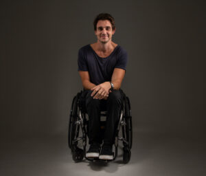 Dean Martelozzo in wheelchair smiling