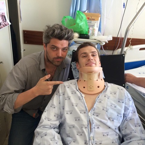 Tom in hospital with a neck brace