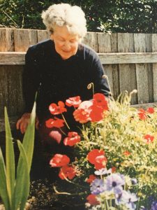 Gwenyth MacNamara tending to flowers in her garden