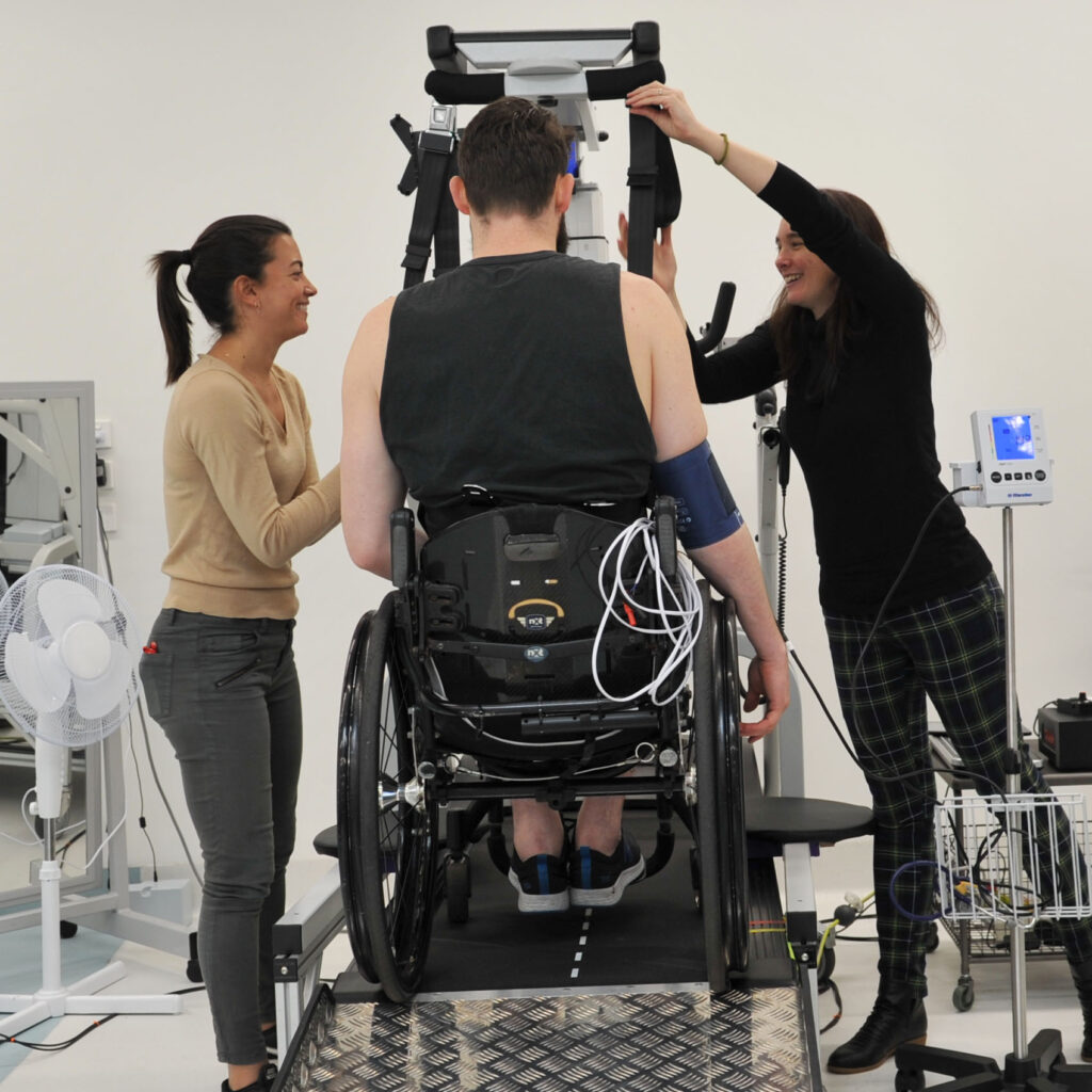 Physios smiling with participant