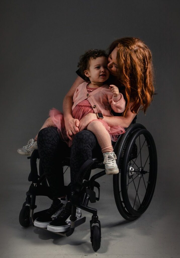 CholoeandBaby2CROPLighter Chloe in wheelchair with her two year old daughter