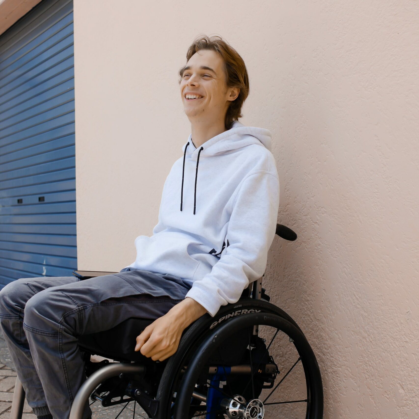 Alex Richter smiling in wheelchair
