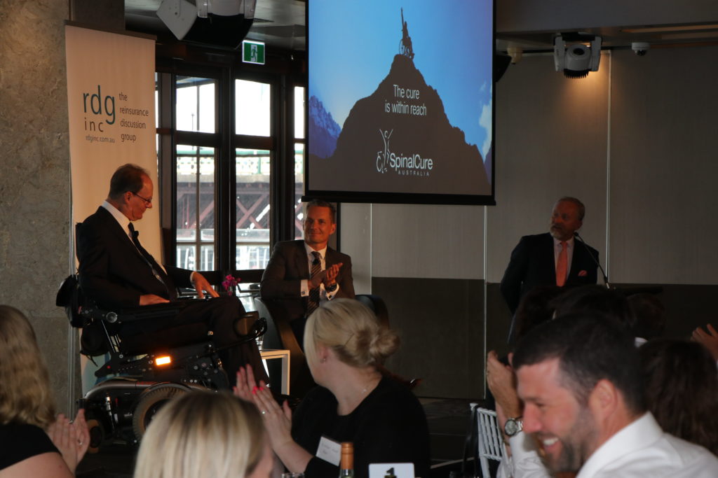 Duncan Wallace, CEO SpinalCure, and Mark Senkevics, Managing Director of Swiss Re ANZ on stage at the RDG event. (Photo by: SpinalCure Australia)